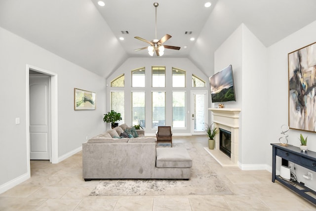 living room featuring ceiling fan and high vaulted ceiling