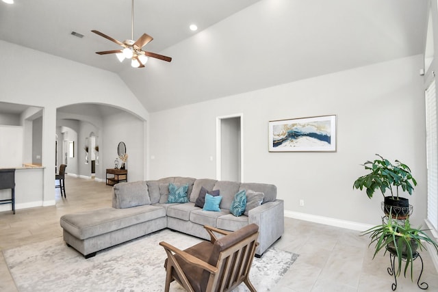 living room with ceiling fan and lofted ceiling