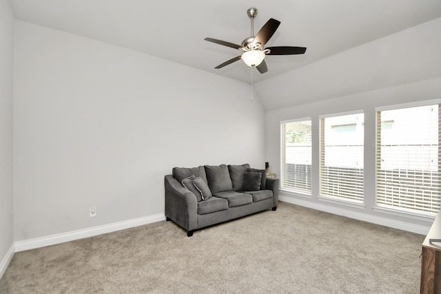 living room featuring light carpet, ceiling fan, and lofted ceiling