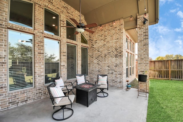 view of patio featuring a fire pit and ceiling fan