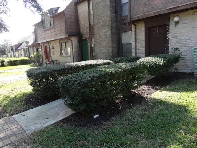view of home's exterior featuring brick siding