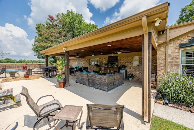 view of patio / terrace with outdoor lounge area, ceiling fan, and a grill