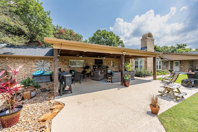 view of patio featuring ceiling fan, area for grilling, and an outdoor living space