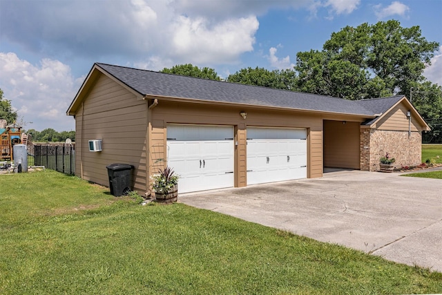 garage featuring a yard