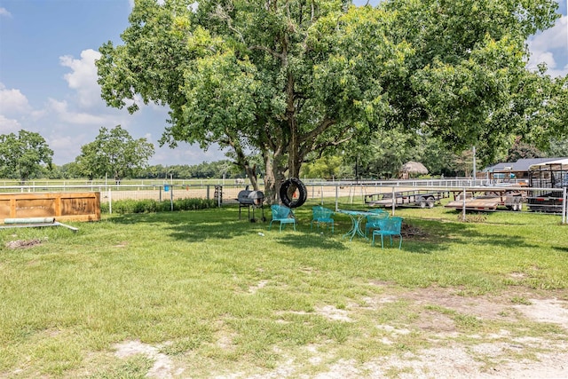 view of yard with a rural view