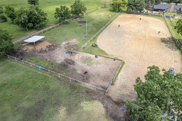 birds eye view of property with a rural view