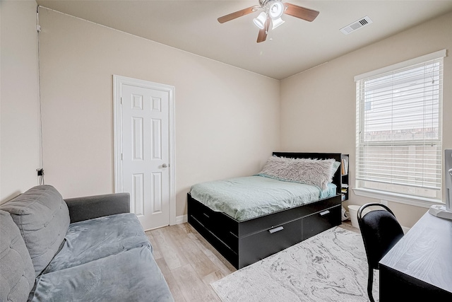 bedroom featuring light wood-type flooring and ceiling fan