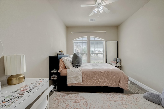 bedroom with light hardwood / wood-style flooring and ceiling fan