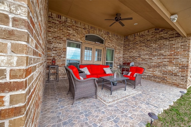 view of patio / terrace with an outdoor living space and ceiling fan