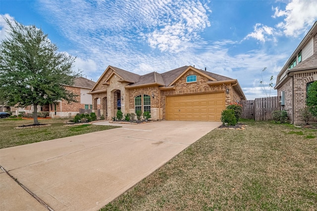 view of front of property with a front lawn and a garage