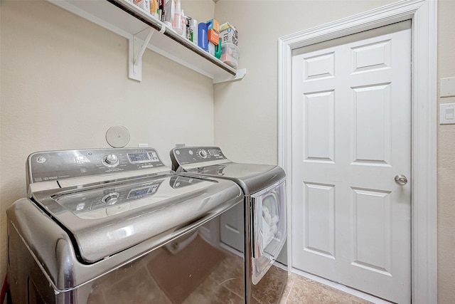 clothes washing area with washer and clothes dryer