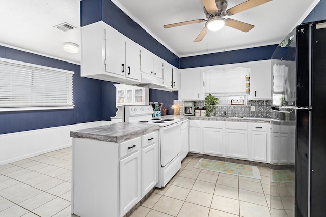 kitchen with white range with electric cooktop, white cabinets, black fridge, ceiling fan, and light tile patterned flooring