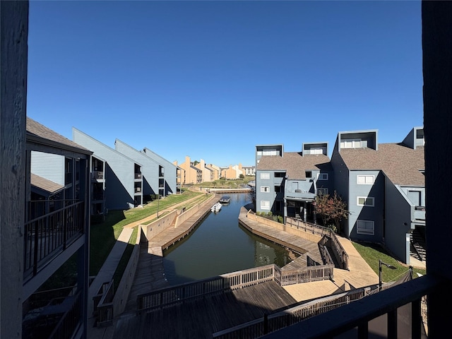 exterior space featuring a water view and a residential view