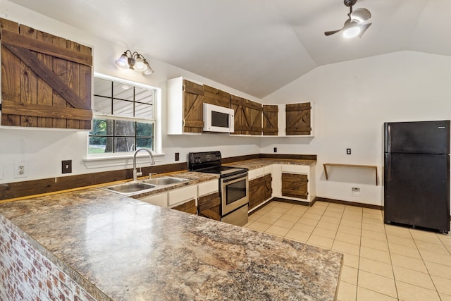 kitchen with lofted ceiling, black appliances, sink, ceiling fan, and light tile patterned floors