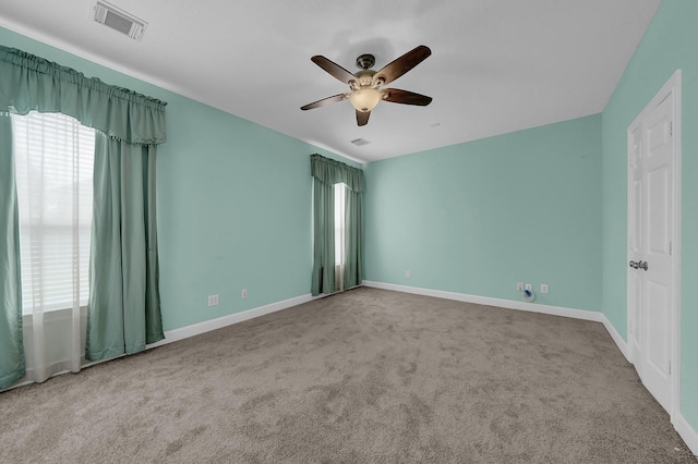 empty room featuring carpet and ceiling fan