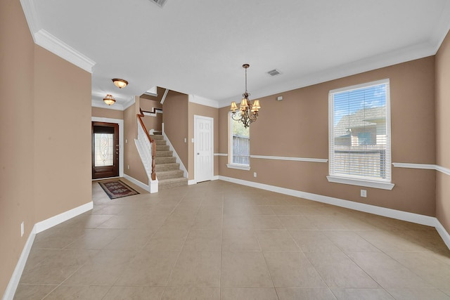 interior space featuring ornamental molding and an inviting chandelier