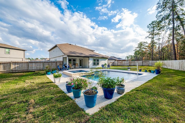 view of pool featuring a yard and an in ground hot tub