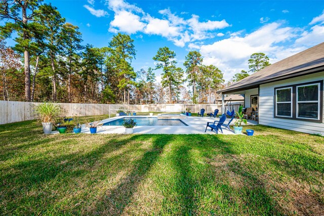 view of swimming pool with a lawn