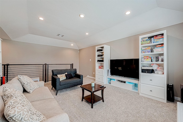 carpeted living room with lofted ceiling