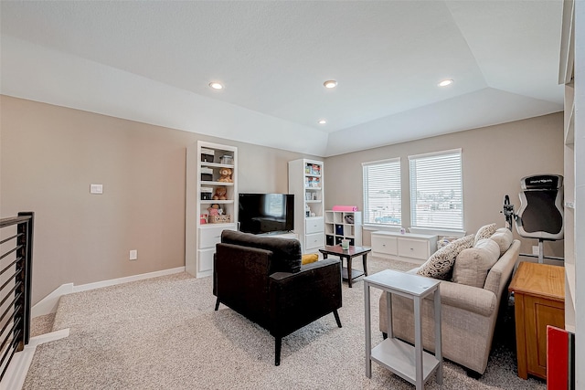 living room with a raised ceiling, built in features, light carpet, and lofted ceiling