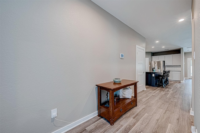 corridor featuring light hardwood / wood-style flooring