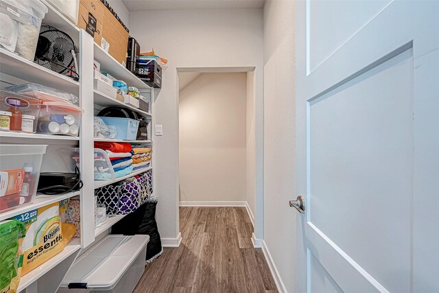 spacious closet featuring hardwood / wood-style floors