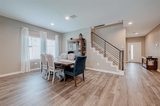 dining room with light hardwood / wood-style floors