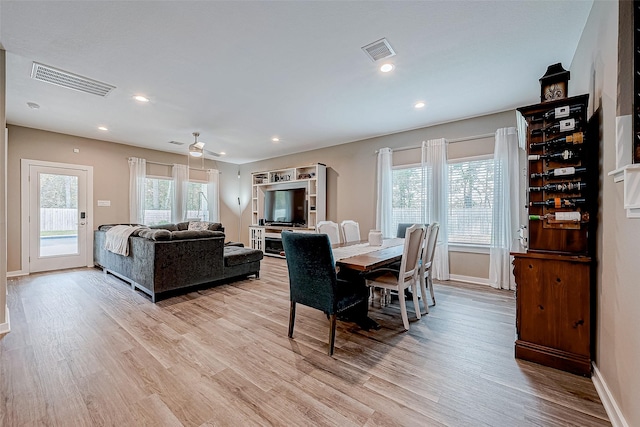 dining area featuring ceiling fan, light hardwood / wood-style floors, and a wealth of natural light