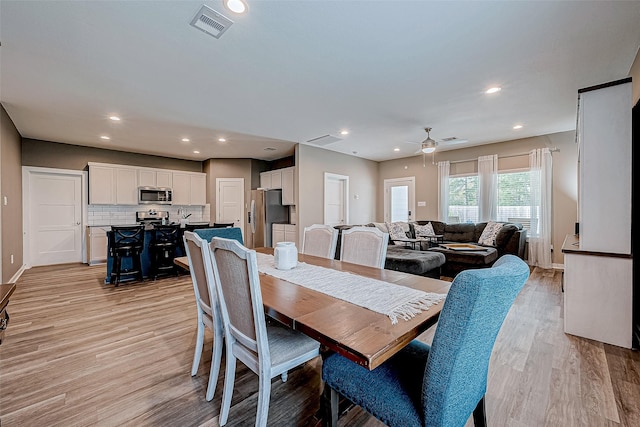 dining space featuring ceiling fan and light hardwood / wood-style floors