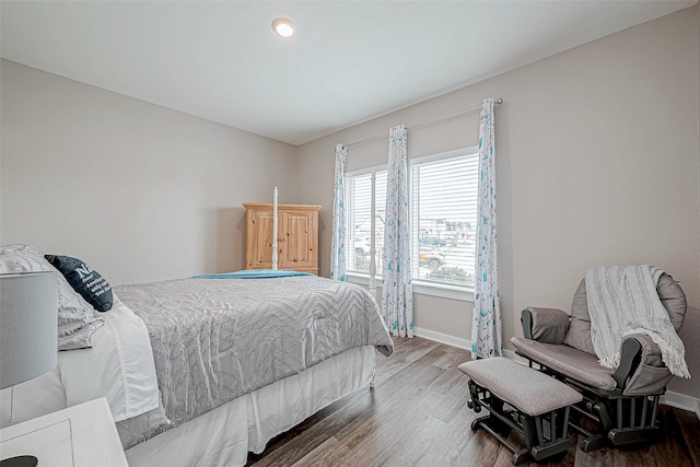 bedroom with hardwood / wood-style flooring