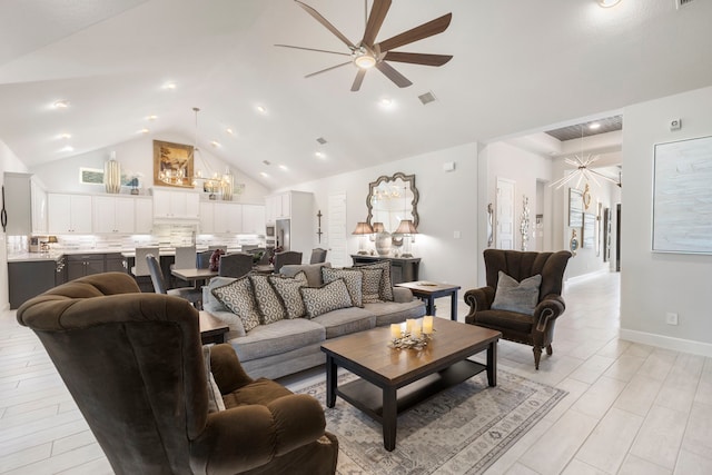 living room featuring ceiling fan, light hardwood / wood-style floors, and vaulted ceiling