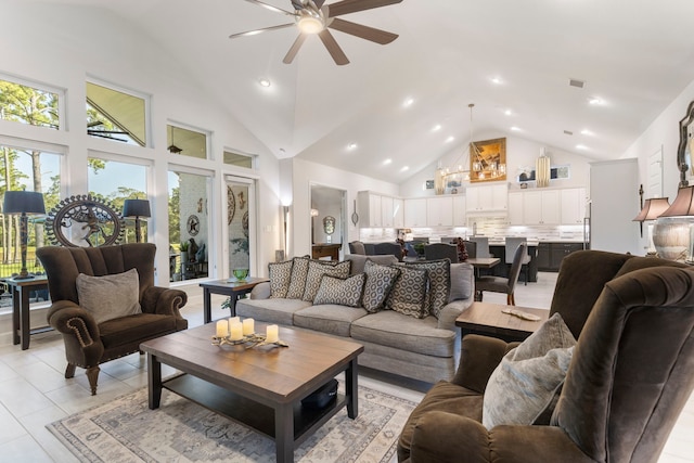 living room featuring light tile patterned floors, high vaulted ceiling, and ceiling fan