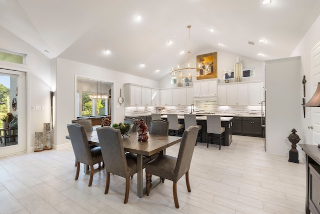 dining room featuring sink, high vaulted ceiling, a healthy amount of sunlight, and pool table