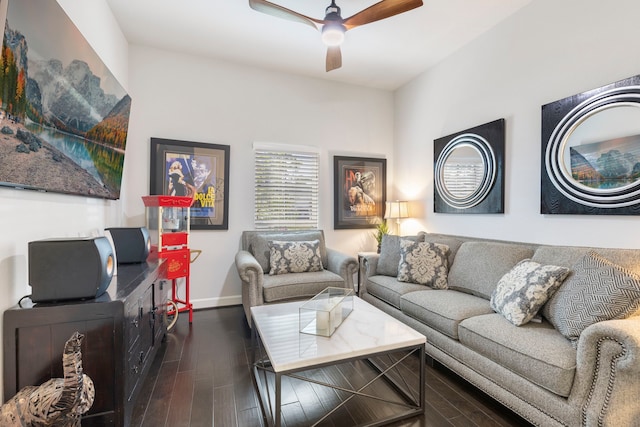 living room featuring ceiling fan and dark wood-type flooring