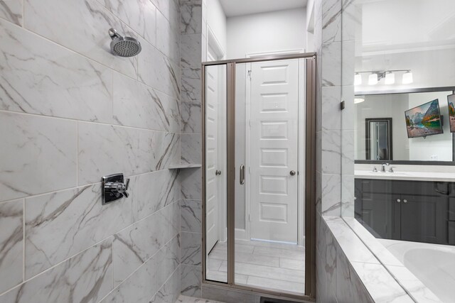 bathroom with vanity and walk in shower