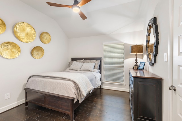 bedroom with ceiling fan, dark hardwood / wood-style floors, and vaulted ceiling