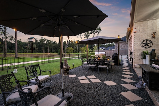 patio terrace at dusk with a lawn