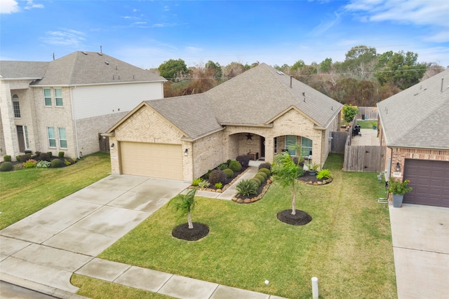 view of front facade with a garage and a front yard