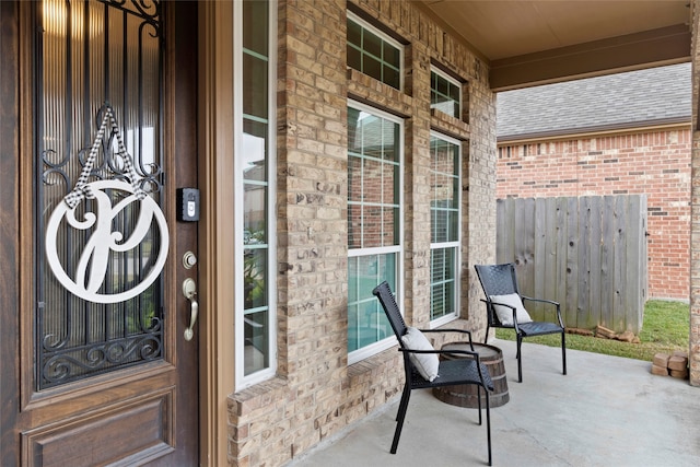 entrance to property featuring covered porch