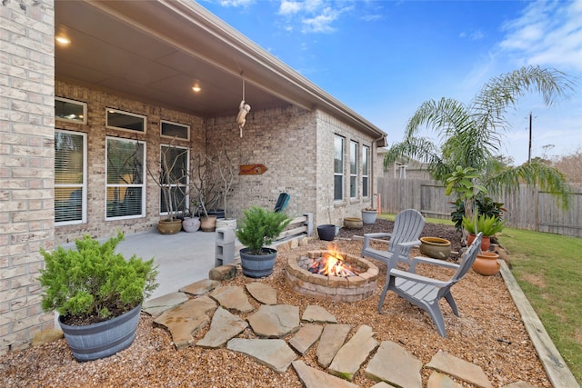 view of patio with an outdoor fire pit