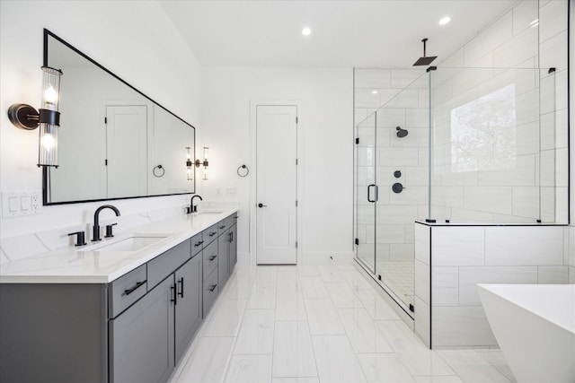 bathroom featuring vanity and plus walk in shower