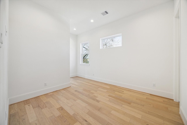 spare room with light wood-type flooring