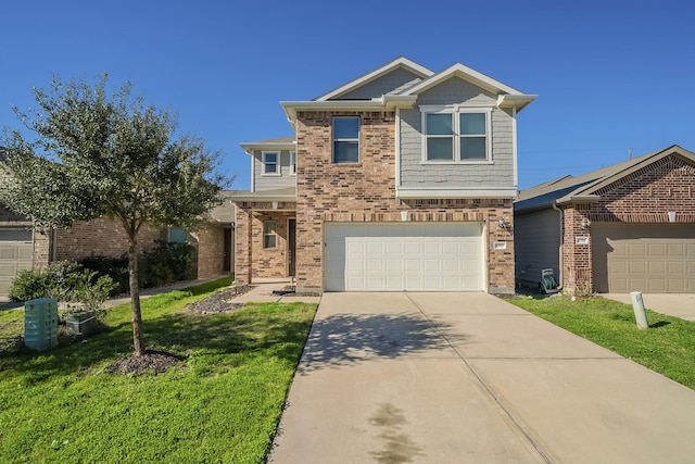 view of front of property with a garage and a front lawn