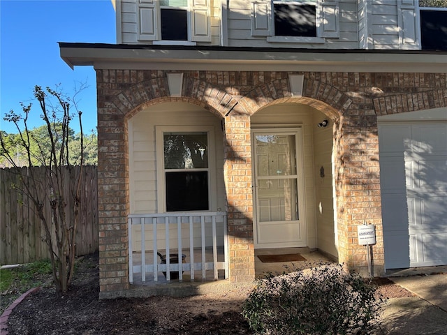 view of exterior entry featuring a garage