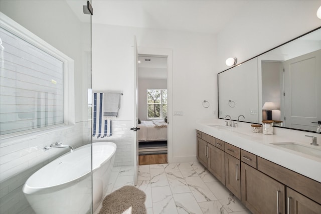 bathroom with vanity and a bathing tub