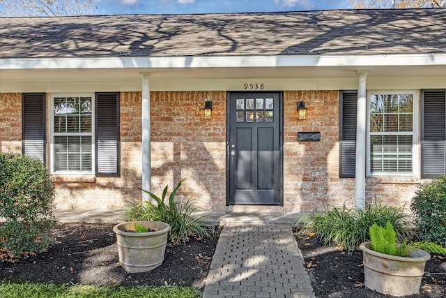 doorway to property with covered porch