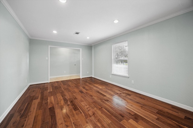 unfurnished room featuring dark hardwood / wood-style flooring and crown molding