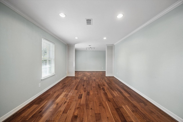 unfurnished room featuring dark hardwood / wood-style floors and ornamental molding