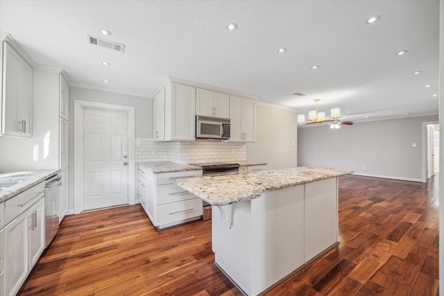 kitchen with ceiling fan, white cabinets, and appliances with stainless steel finishes