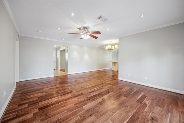 spare room with hardwood / wood-style floors, ceiling fan with notable chandelier, and ornamental molding